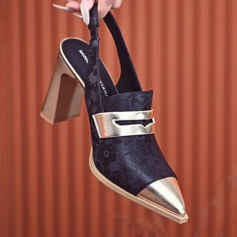 Women's black printed high heel sandals with chunky heel, pointed toe and high-cut straps.