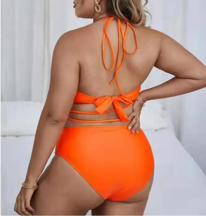 Plus size split bikini set in solid black or orange with sleeveless top and briefs, sizes L to 4XL