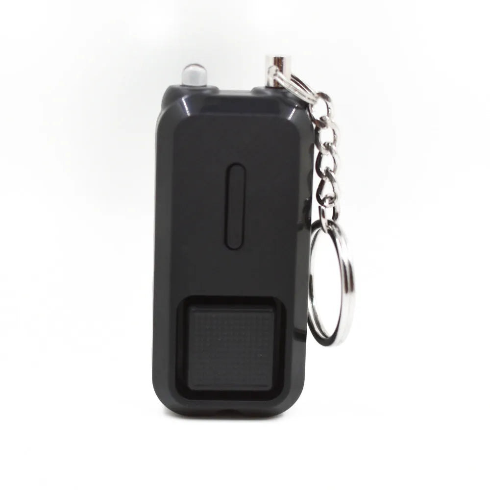 Small pink personal safety alarm with keyring, shown next to its white packaging box.