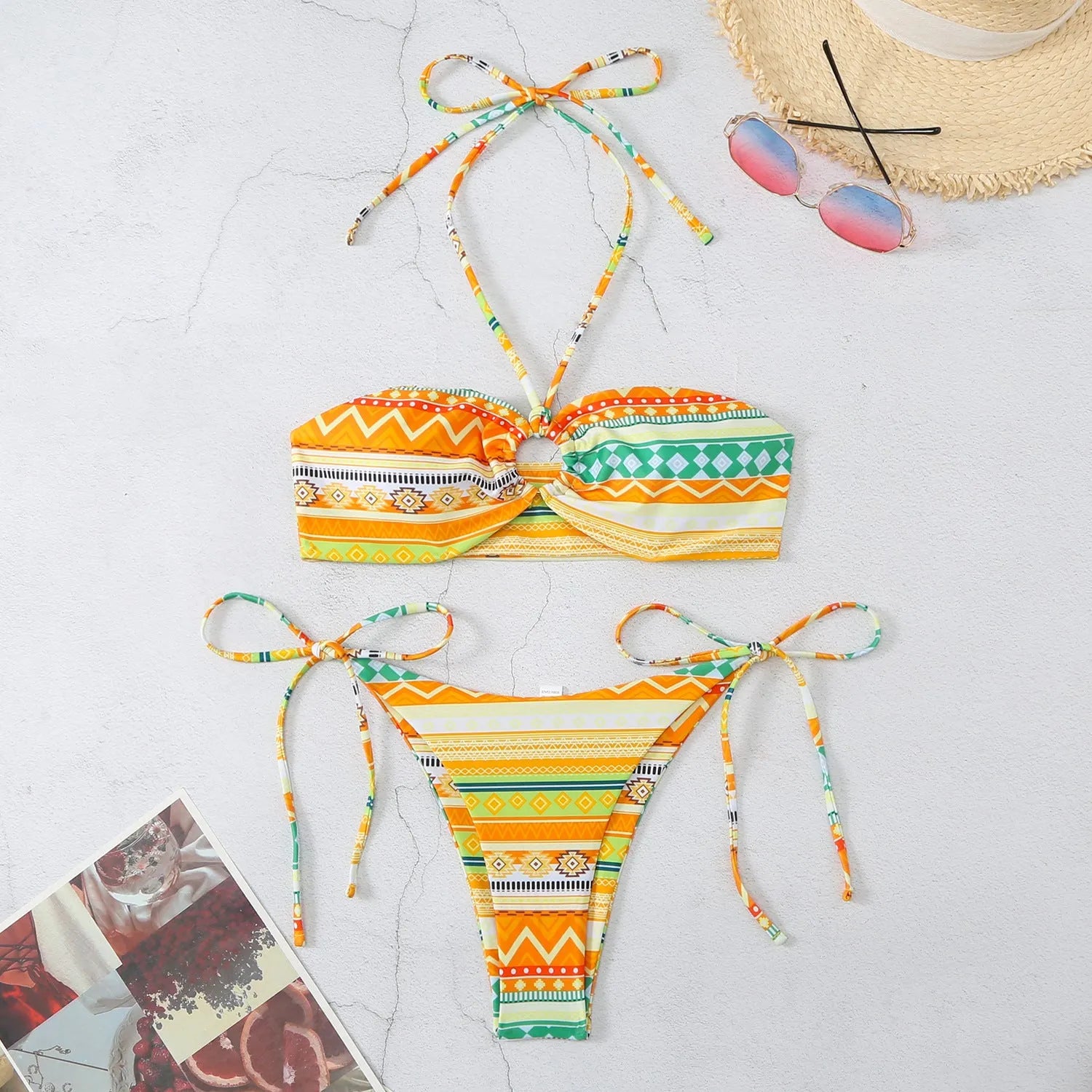 Women's halter bikini swimsuit with split cup design and adjustable tie back in green stripe pattern