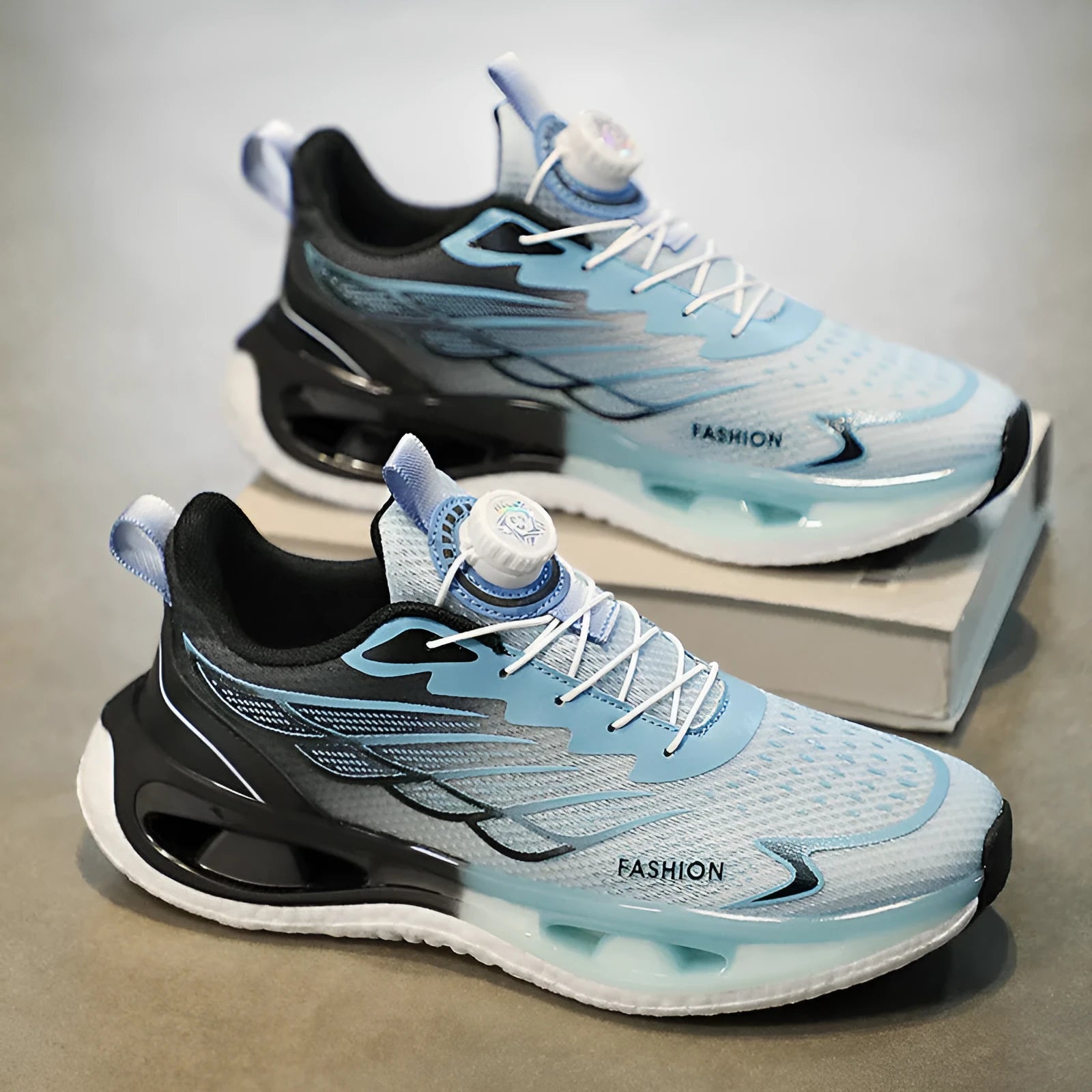 Men's low-top casual sneaker with a rotating button closure, shown in light blue, black, and white/blue colour options.