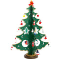 Hand-painted wooden Christmas tree decoration in red and green colours for desktop display