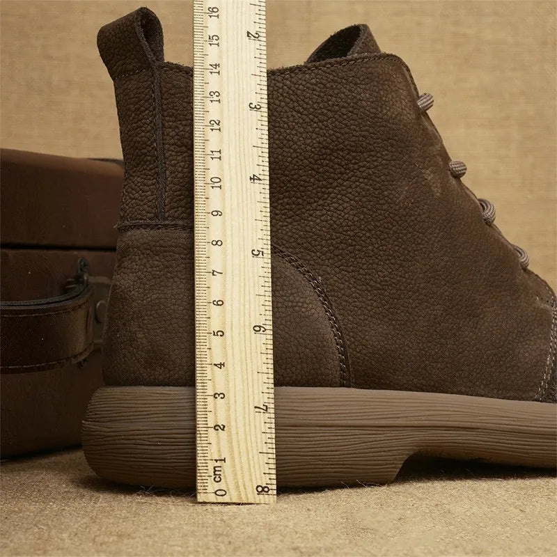 British style grey leather Martin boots with lace-up front and wedge heel on a rubber sole.