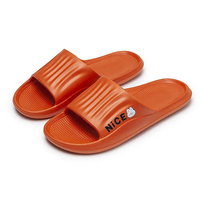 Pair of lightweight EVA flip-flop slippers with a minimalist cartoon pattern and non-slip soles.