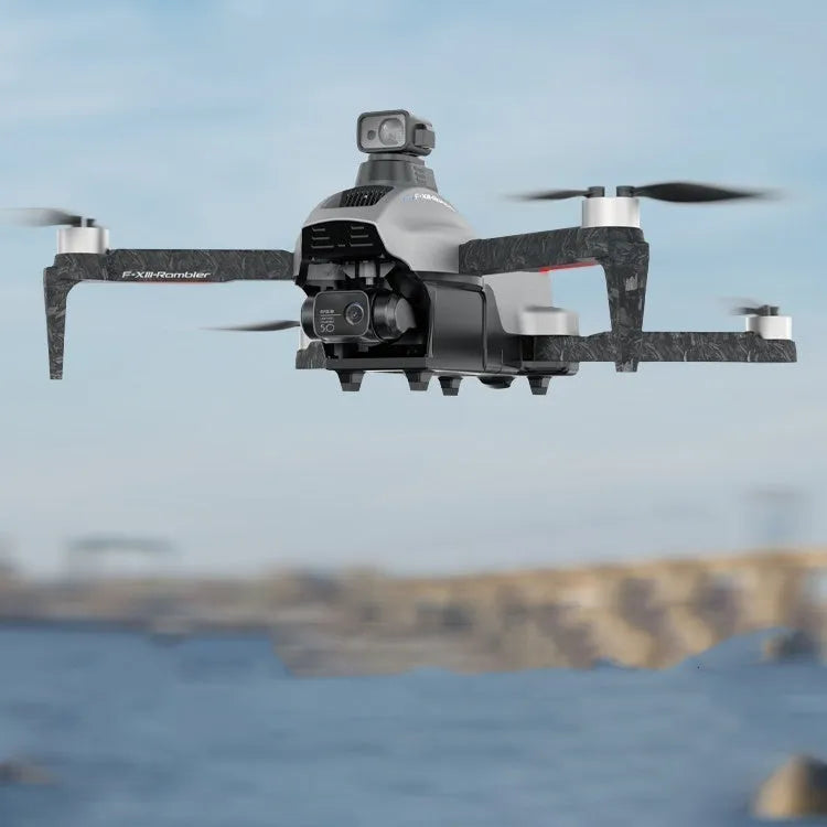 White foldable quadcopter drone with camera, remote control, flight batteries, and shoulder bag laid out.