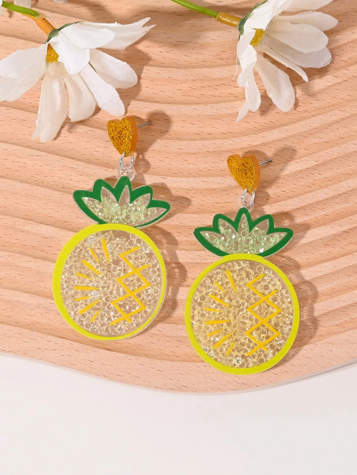 Set of acrylic earrings shaped like cherry, strawberry, watermelon, pineapple, coconut, cake, and ice cream.