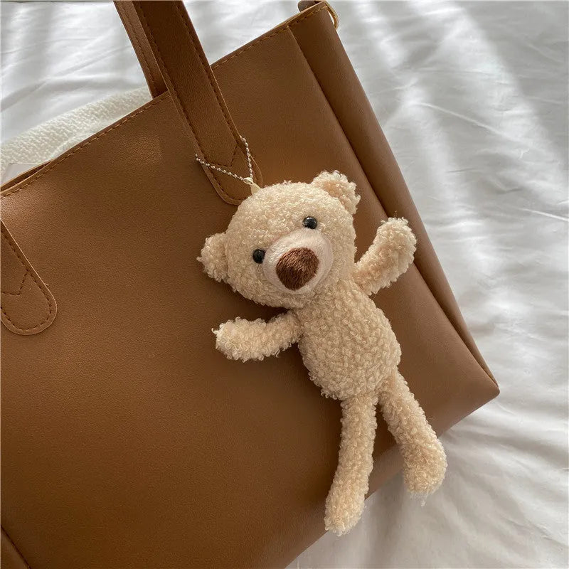 Single shoulder crossbody bag in PU with horizontal square shape, available in white, yellow, black or brown.