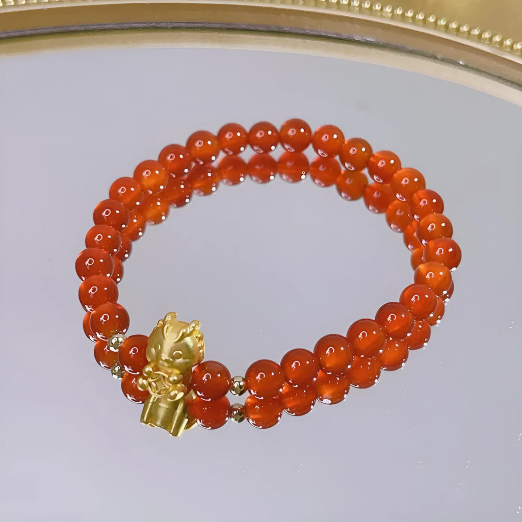 Handmade red agate bracelet with Chinese dragon design for women.