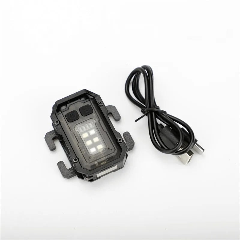 Mini portable tactical warning flashlight with USB charging cable and backpack mount.