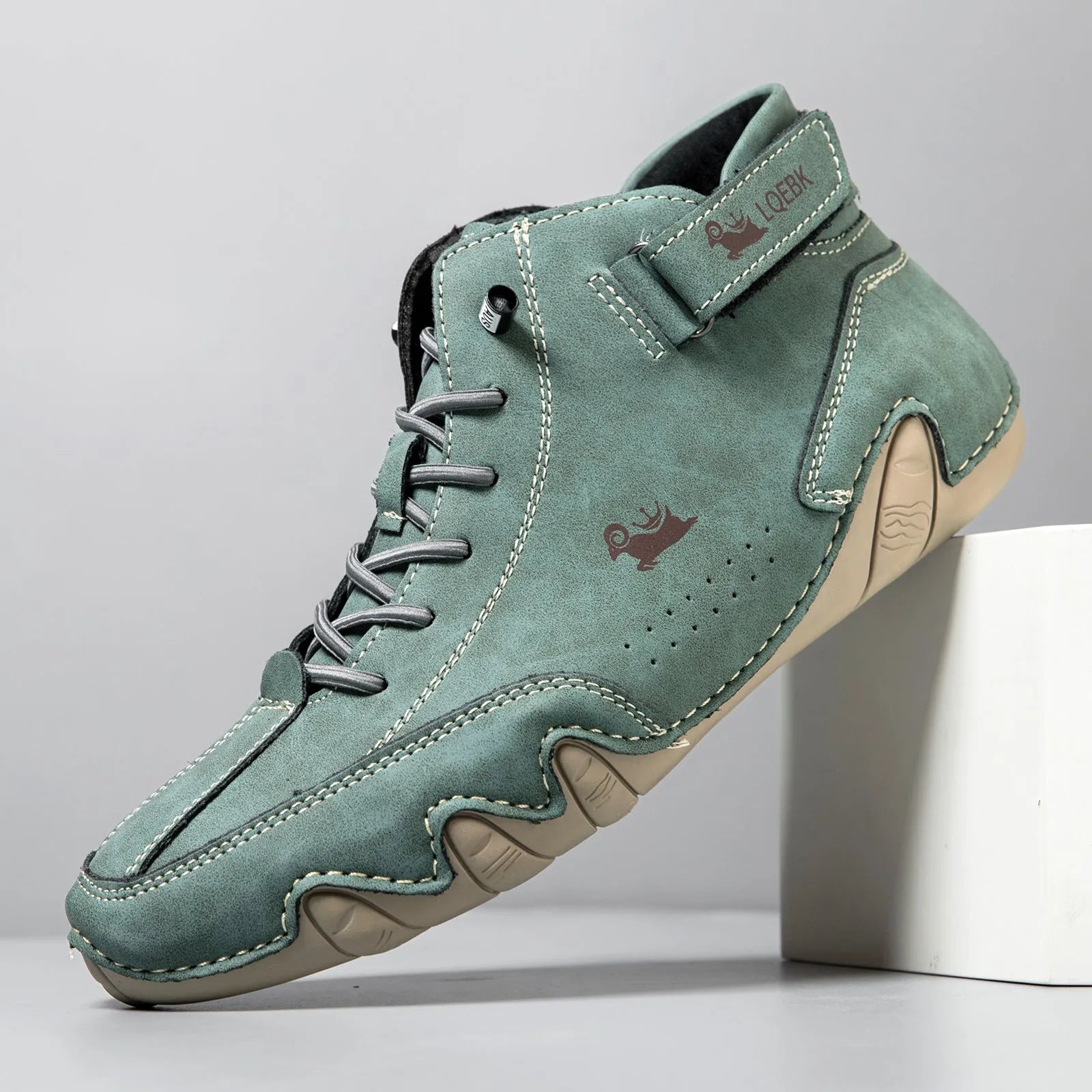 Men's brown high-top Martin boots with round toe and flat rubber sole on a white background.