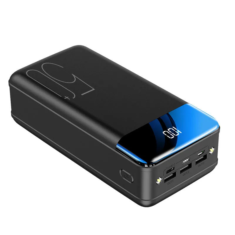 Black and white large 50000mAh power bank with three USB ports showing size scale