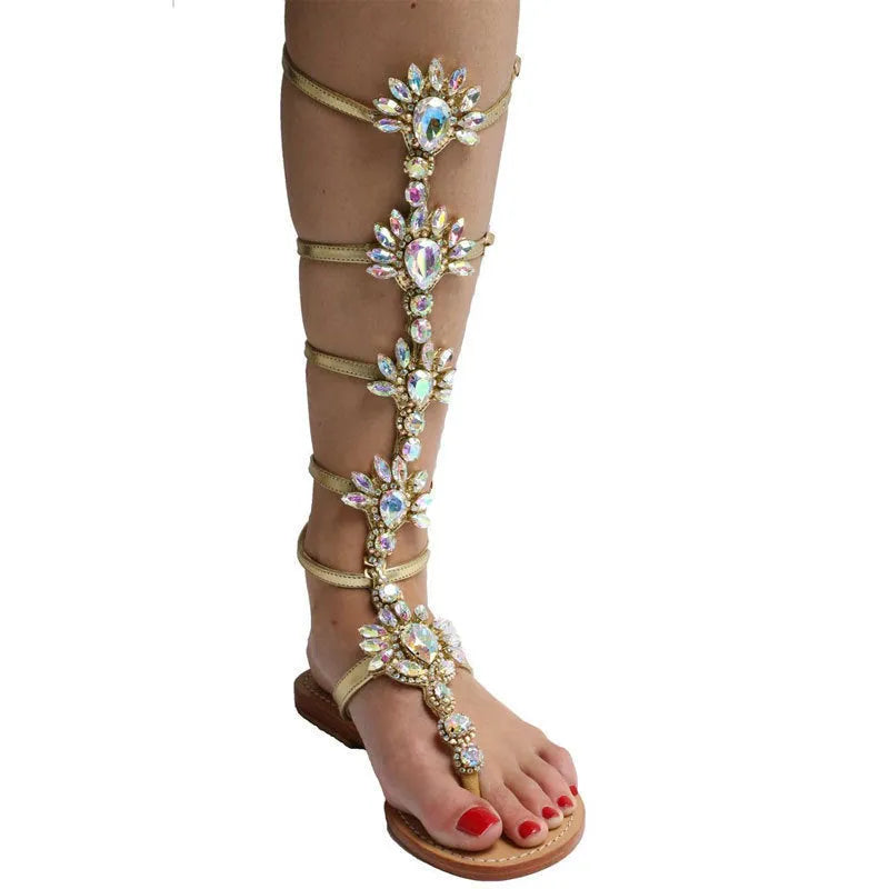 Women's flat roman-style sandals with rhinestone trim in blue artificial PU and rubber sole