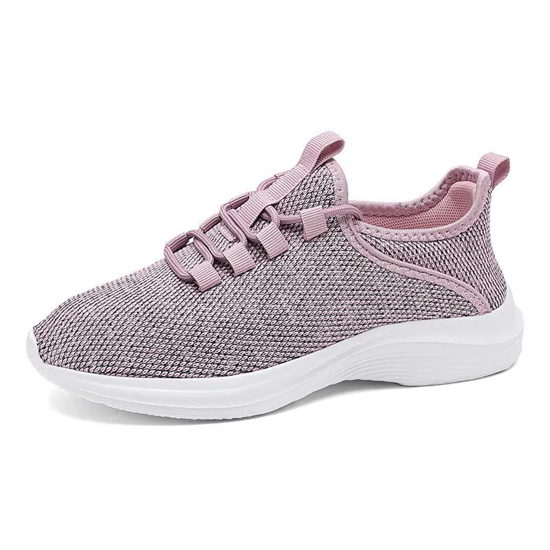 Women's low-top casual sneakers with flyknit mesh upper in black, pink, or grey.
