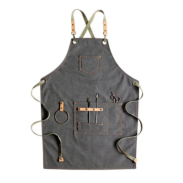 Canvas cross-strap apron in camel colour on hanger