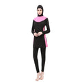 Women's black and blue hooded long sleeve swimsuit top and pants on a hanger.