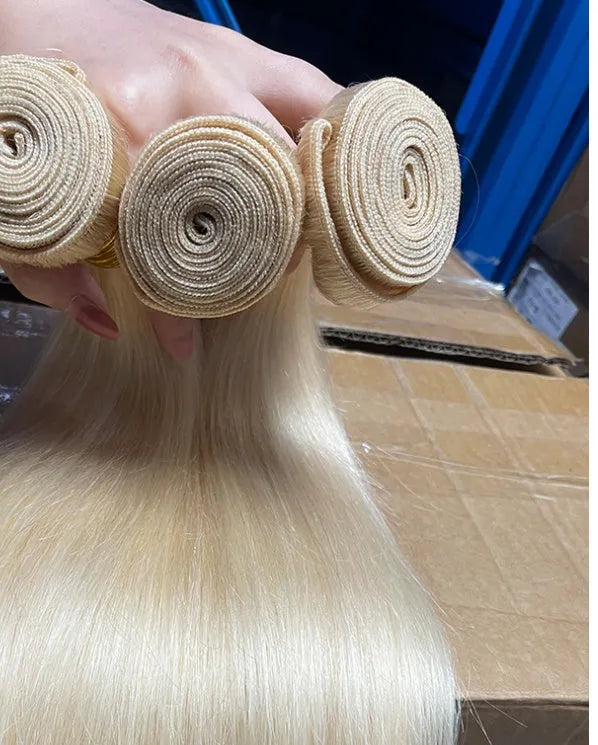 Gold human hair curtain bone straight wig on mannequin head showing long hair length