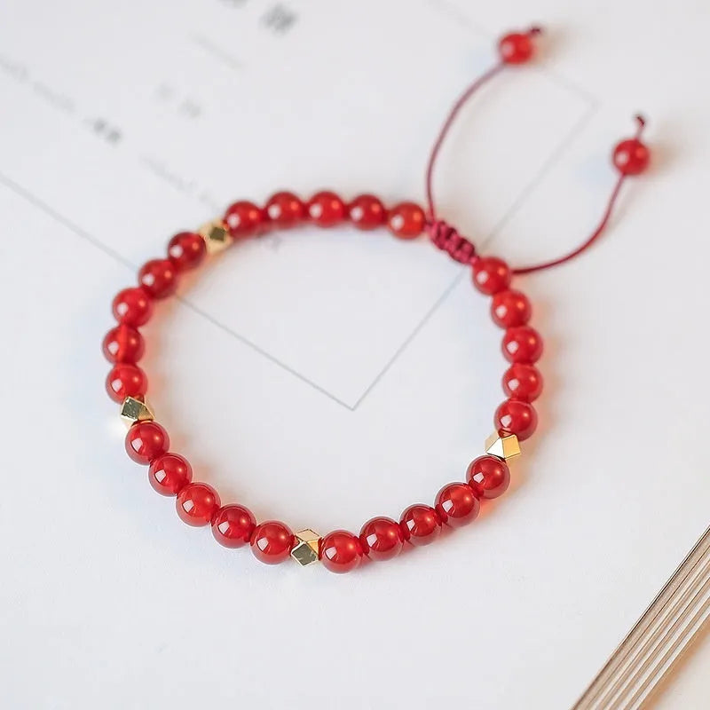 Hand-woven red agate bracelet with ethnic style design and diamond-shaped beads