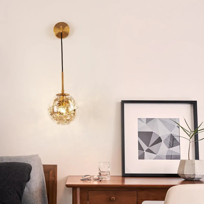 Modern glass wall-mounted bedside lamp in gold or silver finish, shown in 15cm and 20cm size options.