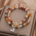 Natural stone women's bracelet with red crystal and double ring design
