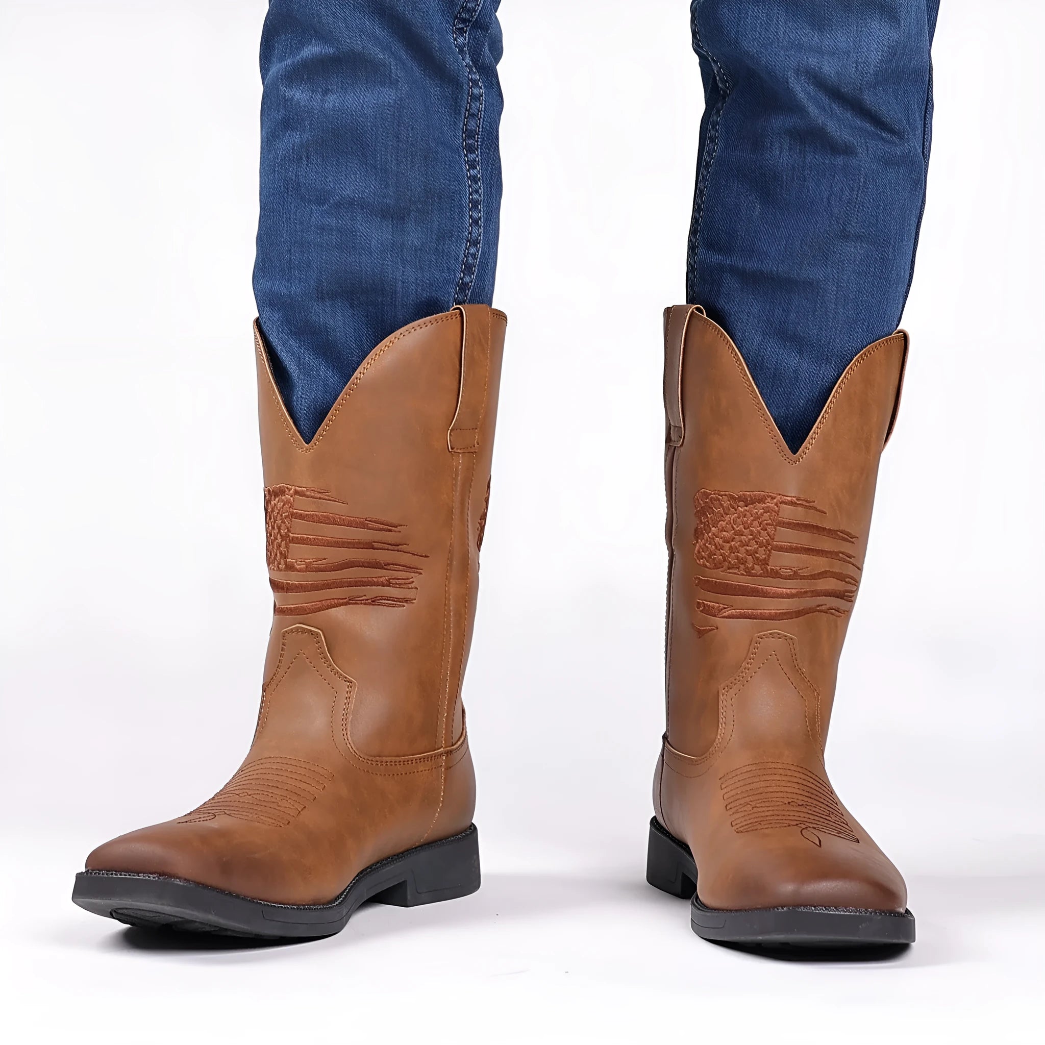 Man's brown retro cowboy boot with high embroidery, wide square toe, and high shaft on a neutral background.