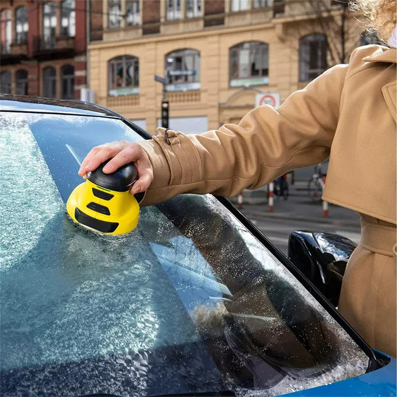Yellow cordless electric snow scraper with ergonomic handle and removal window for car windscreen de-icing