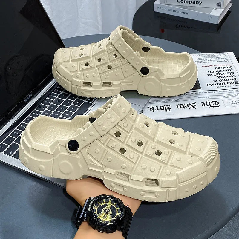 Men's sand-coloured EVA hole shoes with a thick non-slip sole and toe holder design on a plain background.
