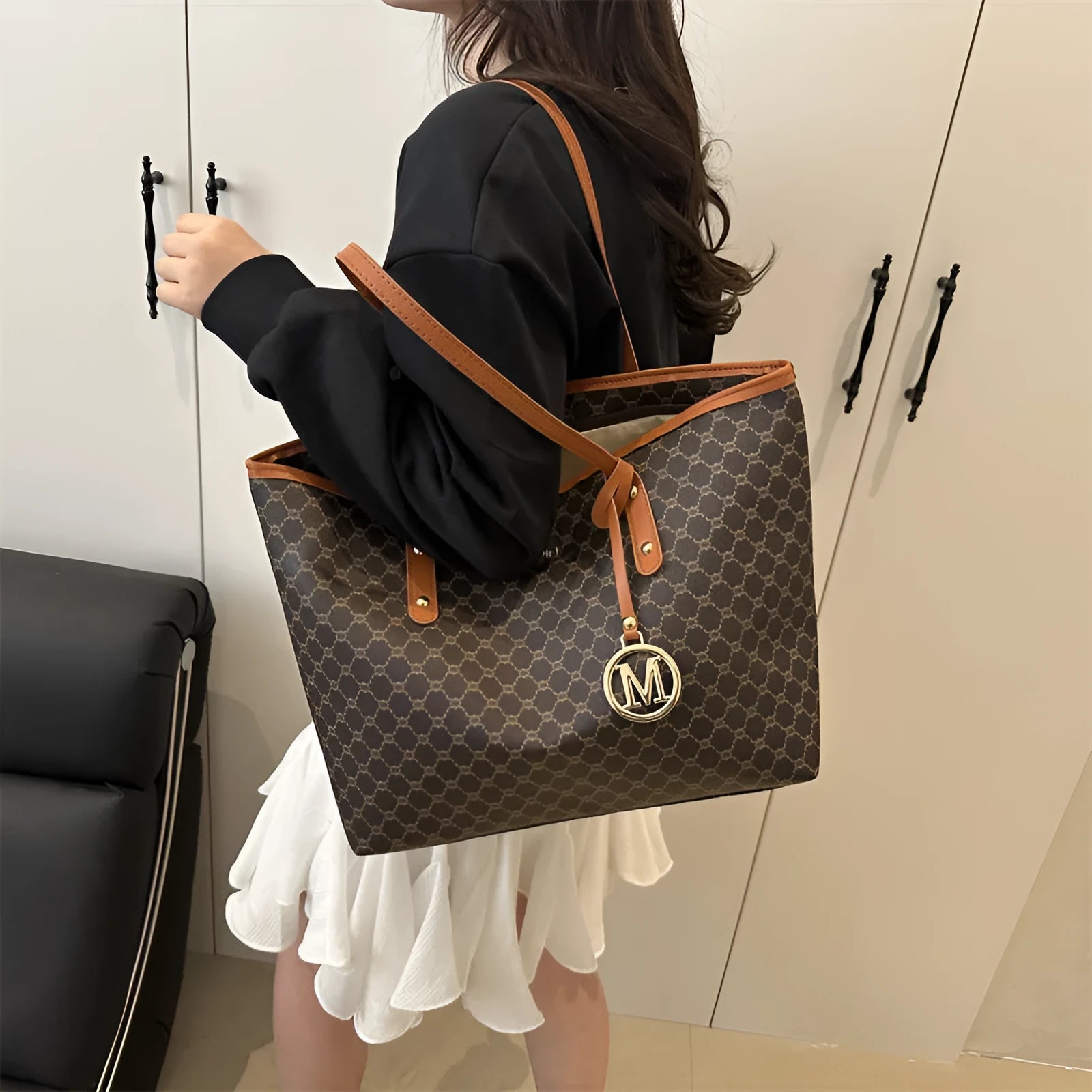 Street style PU shoulder bag with adjustable strap in black colour showing sewing thread detail