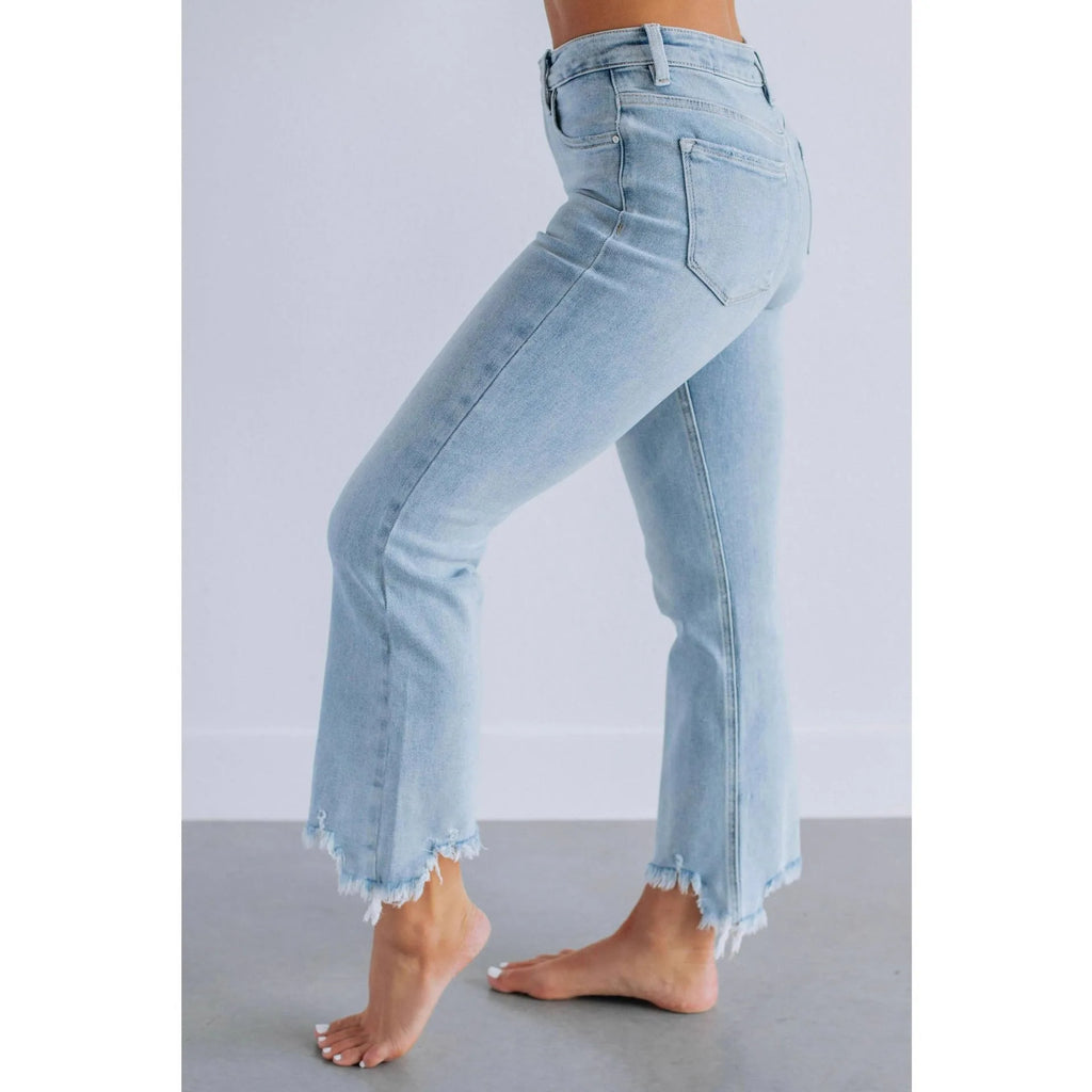 Women's solid colour cotton denim jeans with hand-worn detailing in dark blue and light blue.