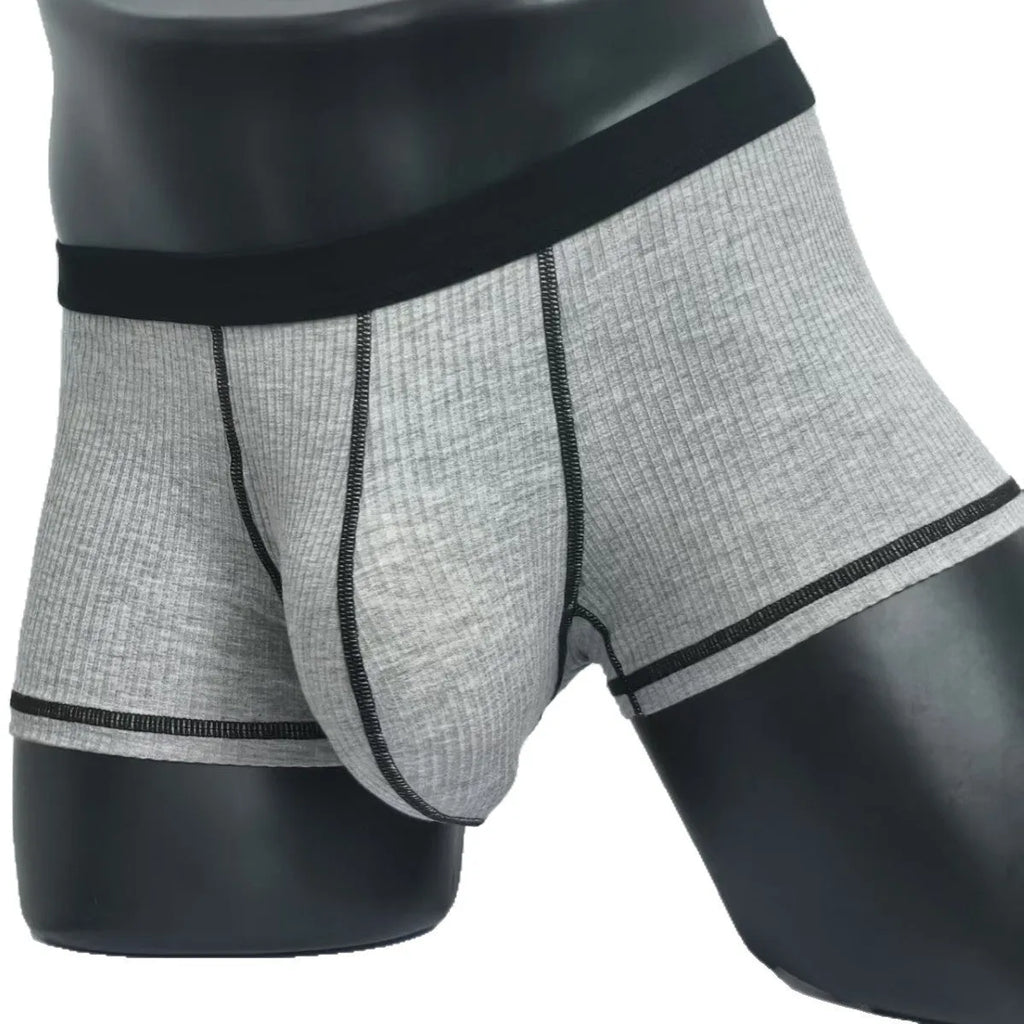 Men's solid colour breathable boxer shorts on a size chart showing weight ranges for L, XL, 2XL, and 3XL.