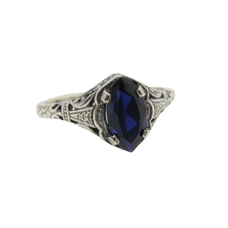 Women's silver geometric hollow ring showing alloy construction and patterned design