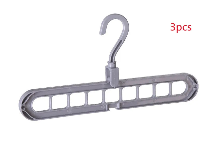 Pink plastic clothes hanger with a 360-degree rotating hook on a white background.