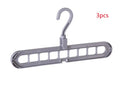 Pink plastic clothes hanger with a 360-degree rotating hook on a white background.