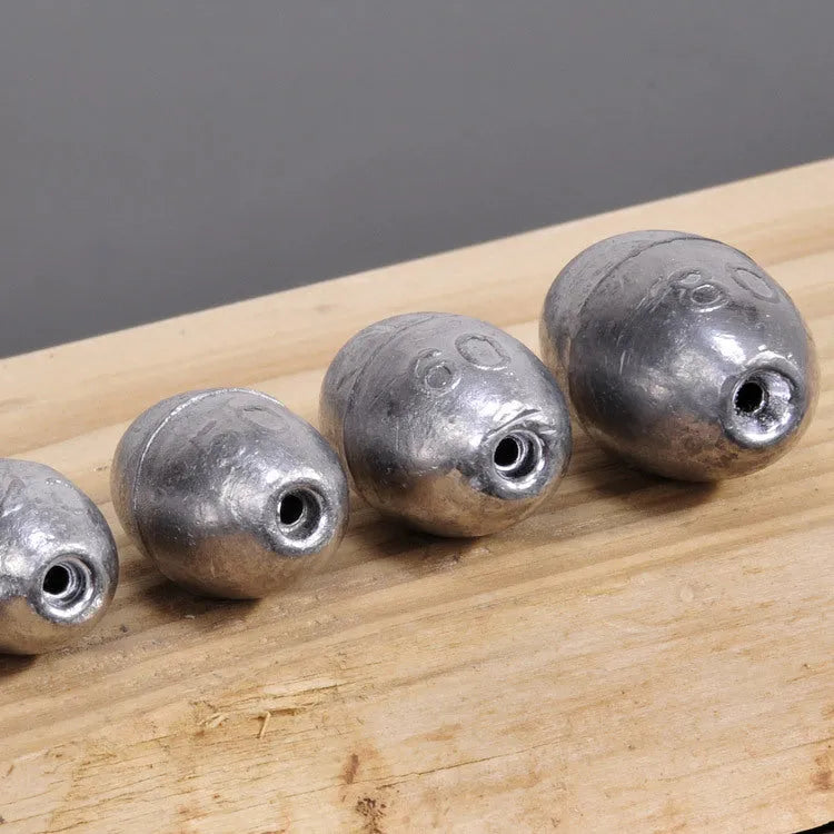 Olive-shaped lead fishing sinkers in sizes 1g to 20g, streamlined design for coarse and carp rigs