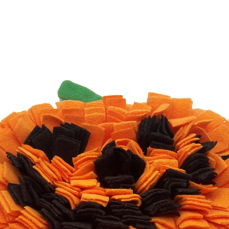 Orange pumpkin-shaped dog sniffing mat with soft fur texture for slow feeding training