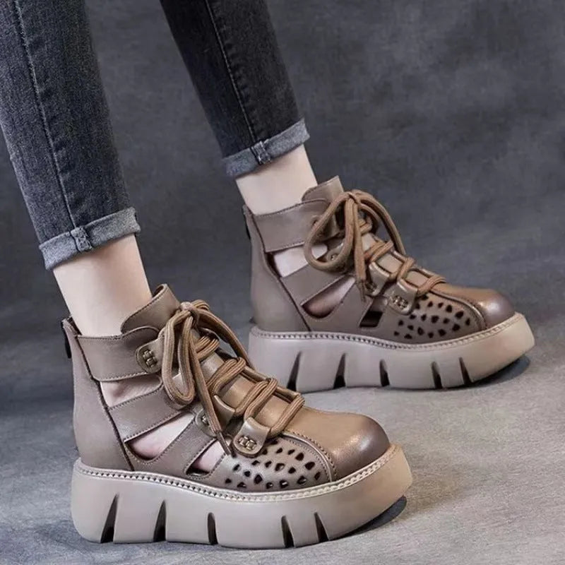 Women's black platform sandals with a hollow hole design and fish mouth toe, made from soft cowhide leather with a PU sole.