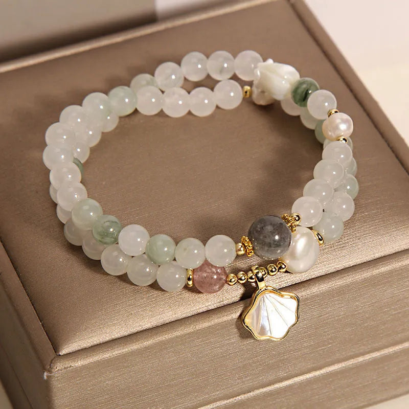Tianshan emerald green crystal bracelet with gold-plated ginkgo leaf pendant and rhinestone accents
