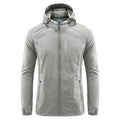 Man wearing a lightweight light grey hooded summer jacket made of thin nylon.
