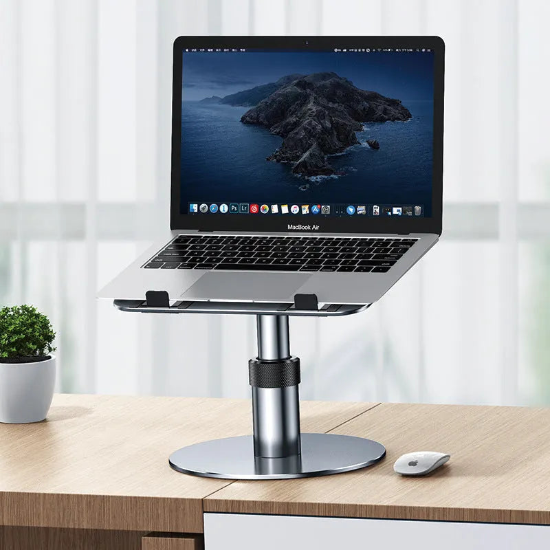 Silver adjustable car laptop stand with rotating base extended on a car seat.