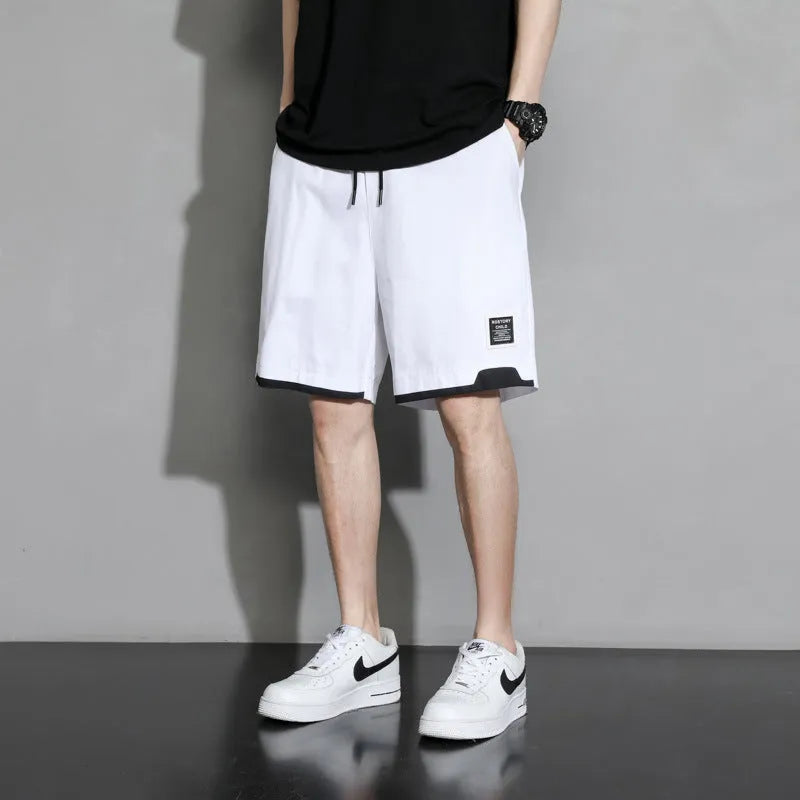 Cotton shorts for boys in plus sizes, showing mid waist and short length design in khaki colour.