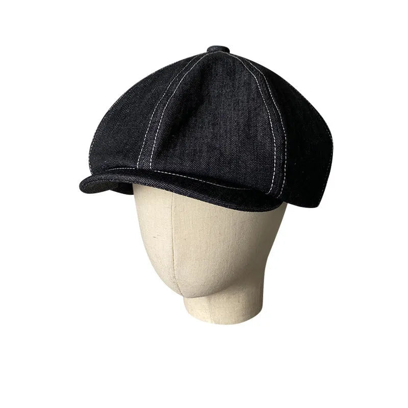 Black Japanese denim beret shown in unisex retro style with adult sizing options