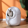 White fully automatic cat litter box with fully enclosed design, door curtain, and 220V US outlet option