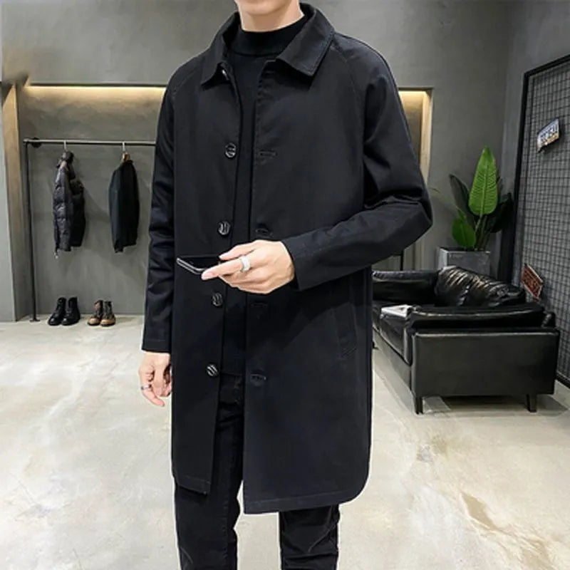 Man wearing a mid-length khaki loose-fit casual trench coat made of rabbit fur.
