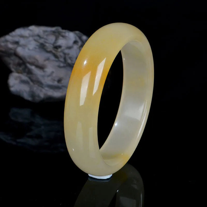 Traditional Chinese jade bracelet with polished finish in multiple sizes from 54mm to 62mm