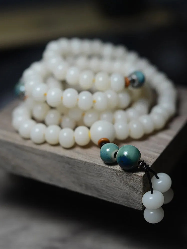 White jade bodhi seed bracelet with 108 flat round beads in 7x9mm and 8x10mm sizes
