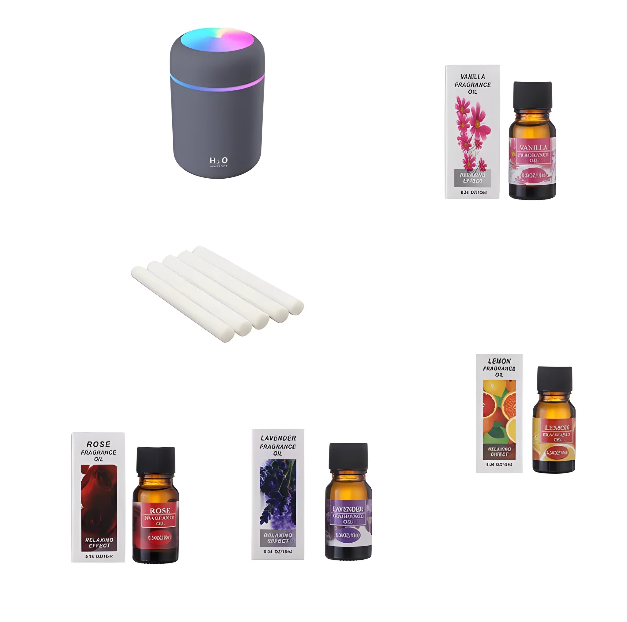 Mini white USB humidifier with 300ml tank and four 10ml essential oil bottles on a wooden table