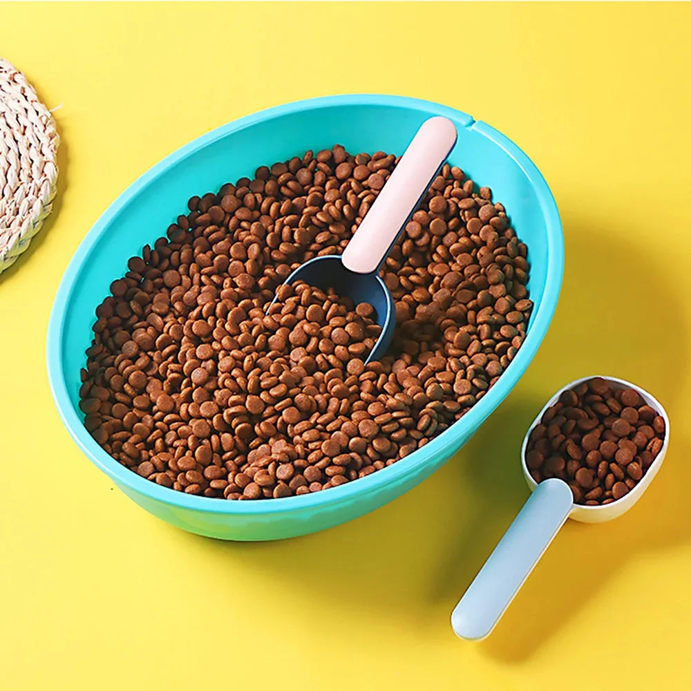 Blue plastic pet food scoop with 1 cup measure and bag clip handle on white background