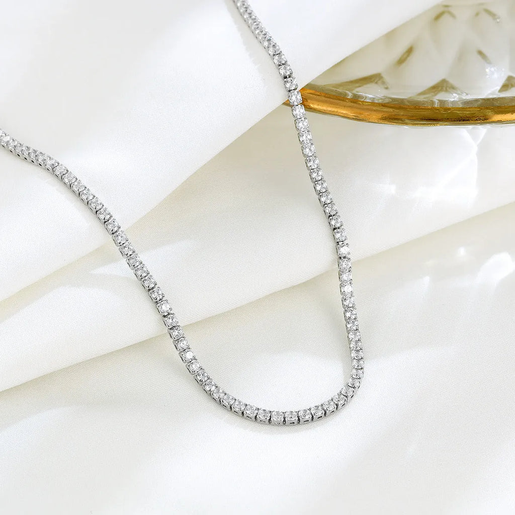 Women's sterling silver necklace with diamond-cut round pendant