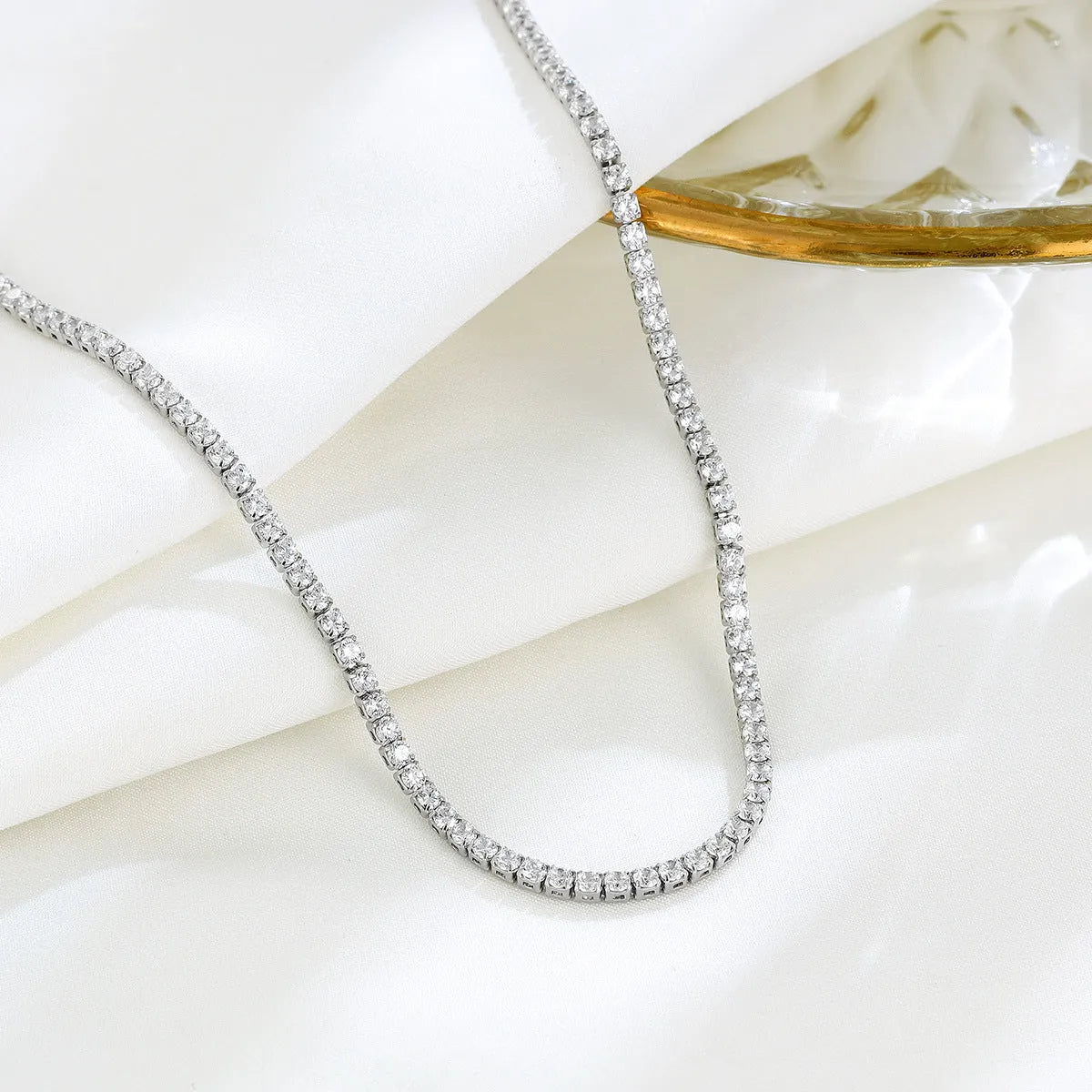 Women's sterling silver necklace with diamond-cut round pendant