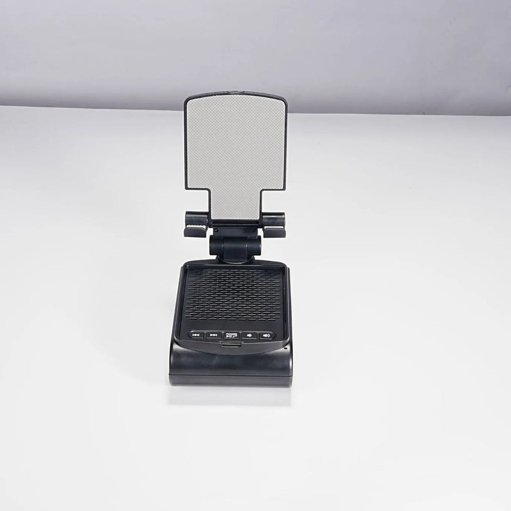 Multi-function lazy phone holder with Bluetooth audio in black plastic on a desk showing a smartphone in landscape mode