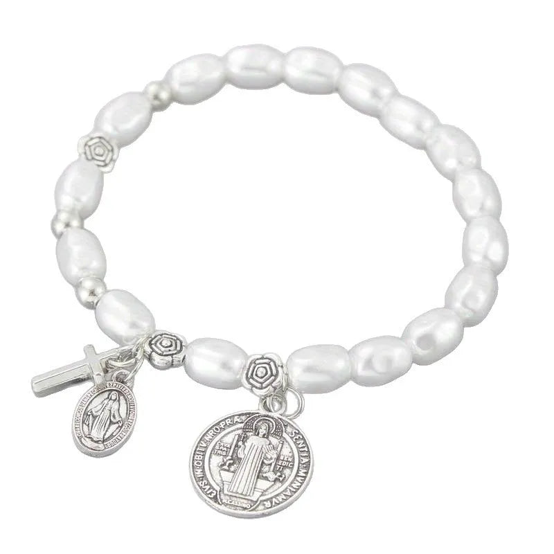 Silver beaded flower bracelet on display with metal links